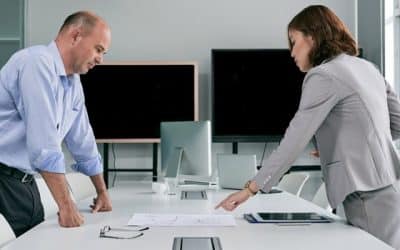 Two business leaders reviewing a project plan and deciding ERP implementation scope