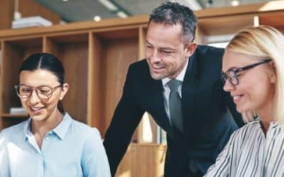 Business team reviewing ERP budget figures together in a modern office